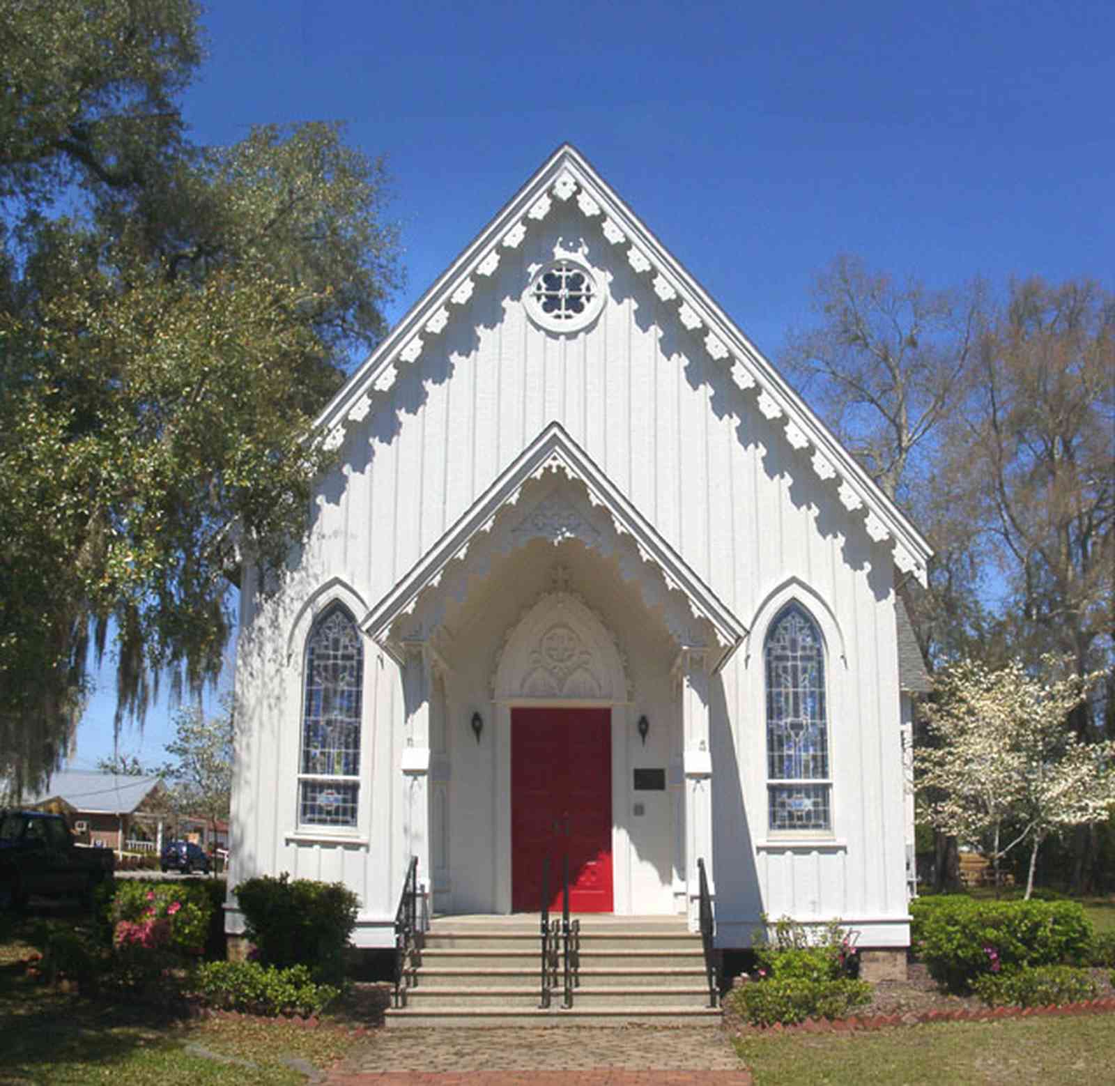 Milton:-Historic-District:-St.-Mary-Episcopal-Church_04.jpg:  gingerbread trim, victorian architectural style, dogwood tree, oak tree, spanish moss