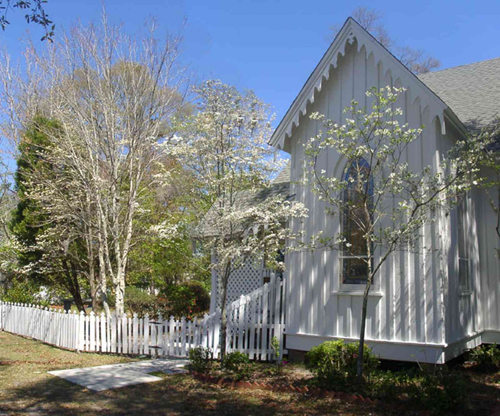 Milton:-Historic-District:-St.-Mary-Episcopal-Church_05.jpg:  picket fence, dogwood tree, victorian architecture, folk victorian style