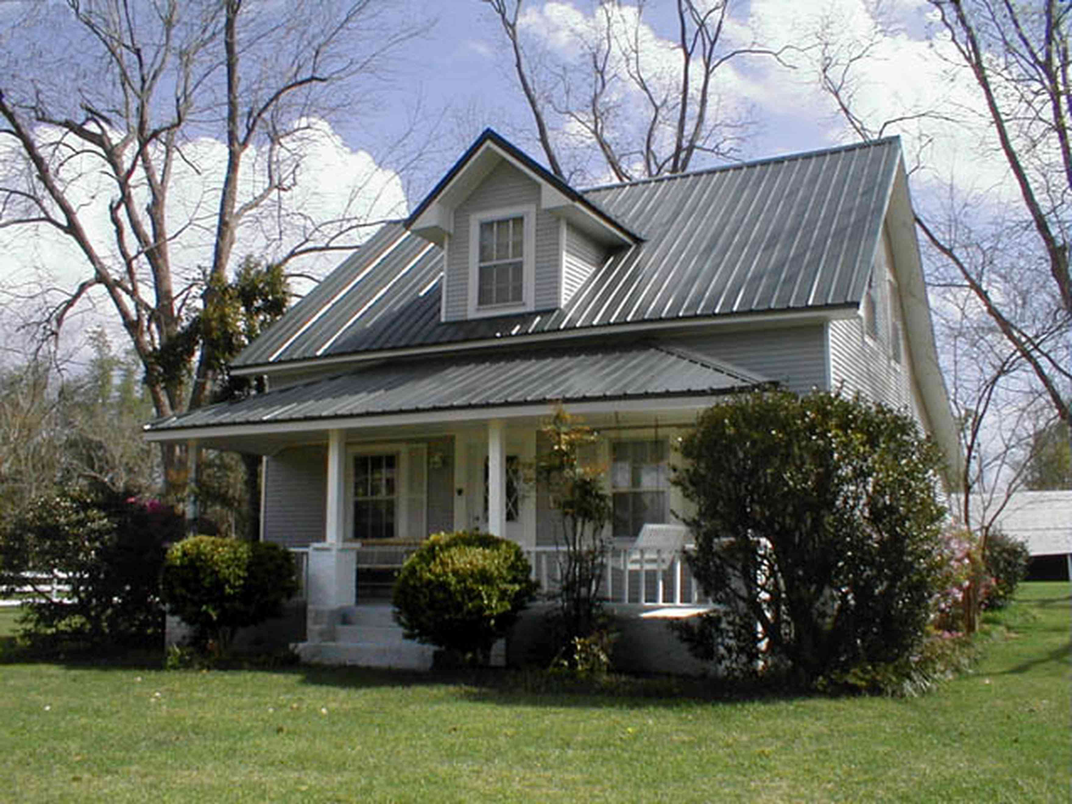 Molino:-Green-Farm_00.jpg:  1930's farm house, front porch, tin roof, pecan trees, farm, pasture, barn