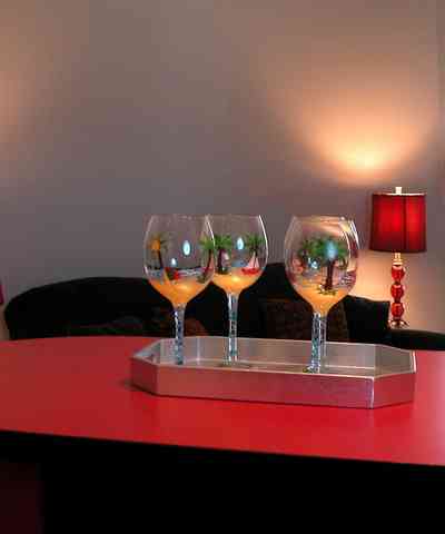 Navarre:-7332-Grand-Navarre-Blvd_27a.jpg:  kitsch, art deco, bar glasses, red lacquered cabinets, red jewel lamp