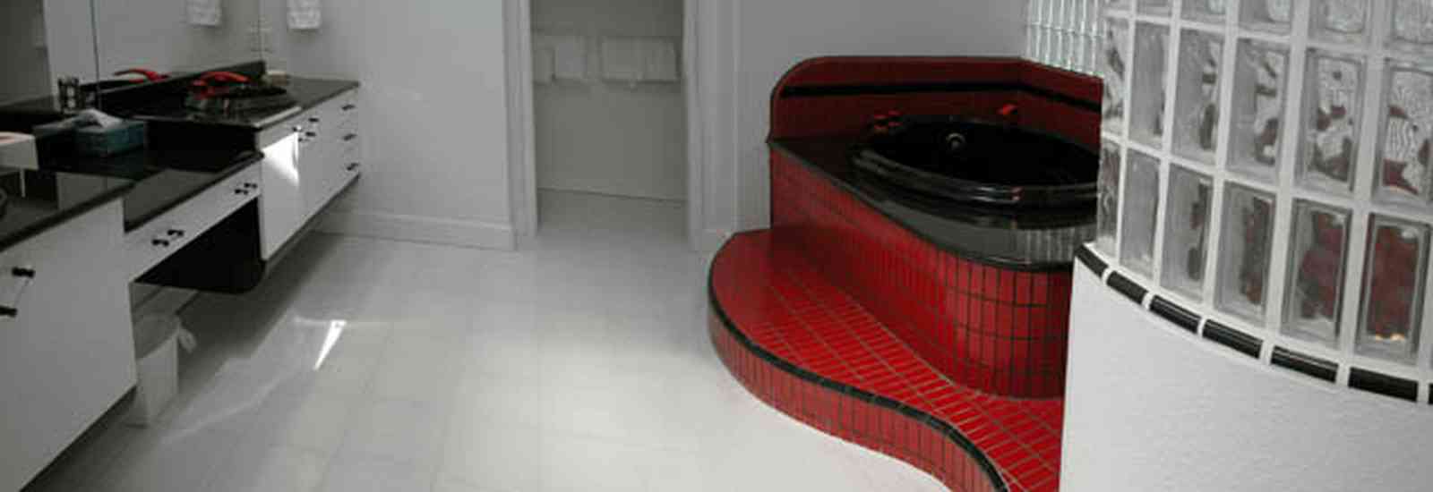 Navarre:-7332-Grand-Navarre-Blvd_50.jpg:  art deco house, bath tub, black laquer cabinets, white marble floor, glass bricks, beach house