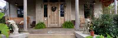 North-Hill:-1020-Reus-Street_02.jpg:  porch, ferns, victorian house, lions