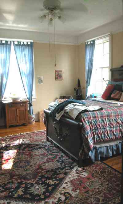 North-Hill:-105-West-Gonzales-Street_64.jpg:  oriental rug, sleigh bed, drapes, antique furniture, quilt, hardwood floor