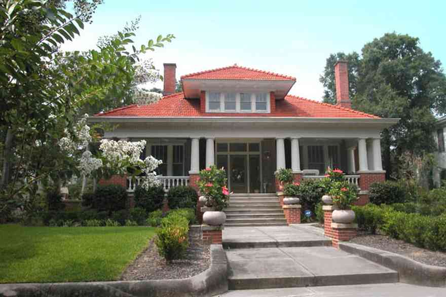 North-Hill:-116-DeSoto-St_00.jpg:  crepe myrtle, red tile roof, fireplace, white columns, oak tree, urns, hibicus