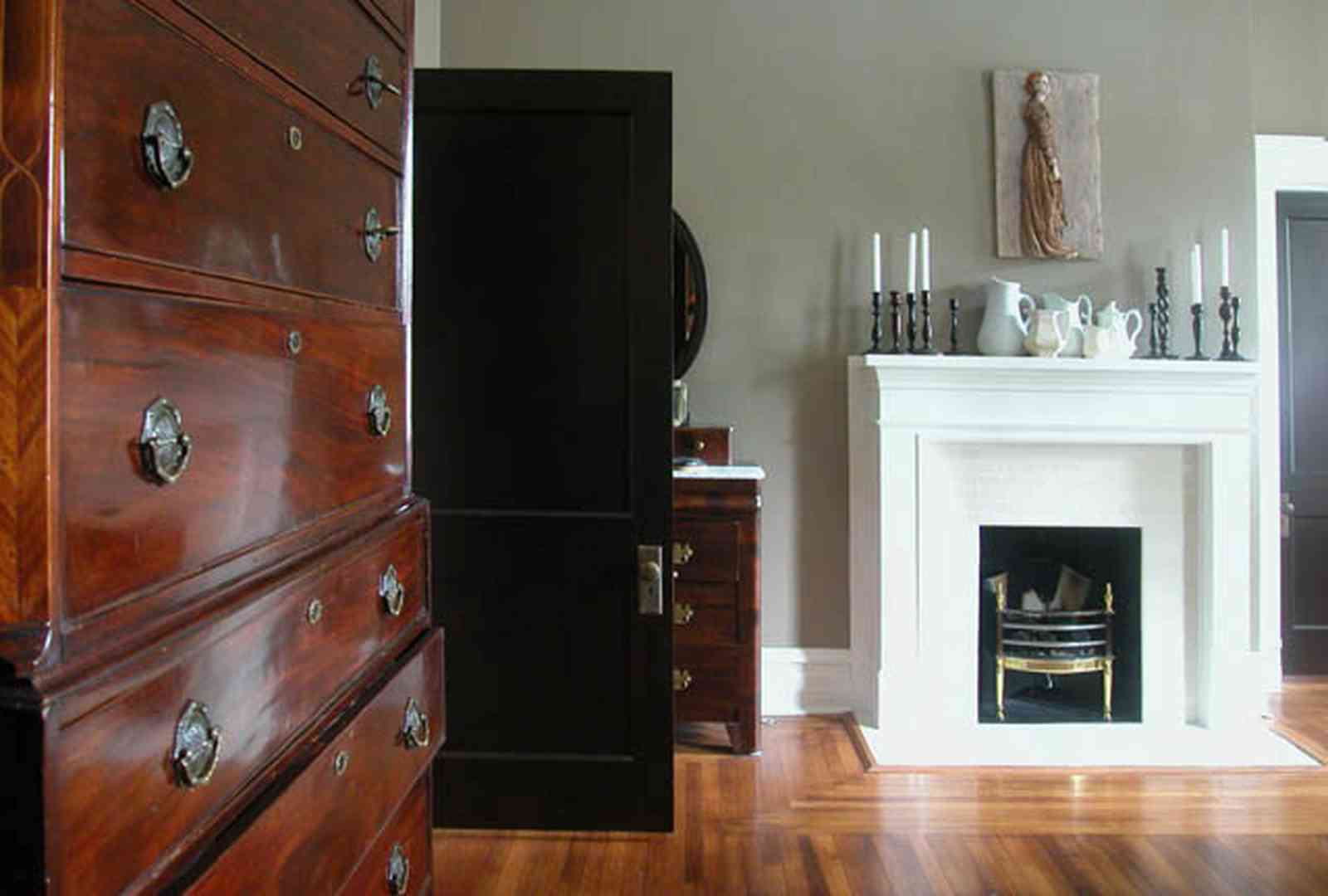 North-Hill:-116-DeSoto-St_02t.jpg:  bedroom, fireplace, mantle, highboy dresser, heartpine floor
