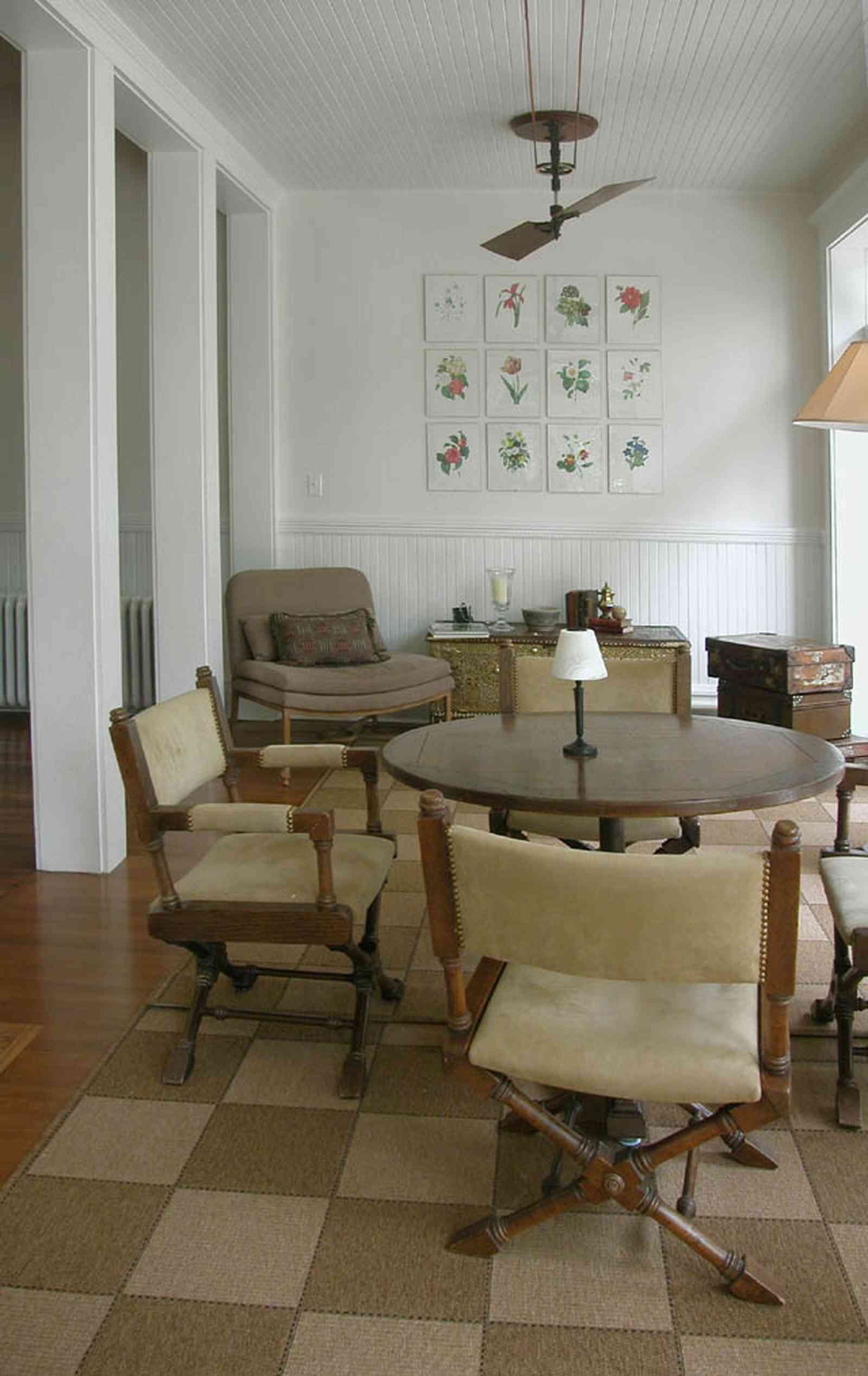 North-Hill:-116-DeSoto-St_13.jpg:  sunroom, ceiling fan, grass rug, heartpine floor