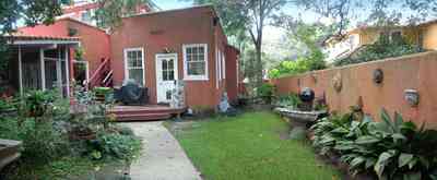 North-Hill:-123-West-Lloyd-Street_28.jpg:  stucco walls, garden, backyard, fountain, screened porch, deck, porch, italienate style