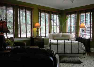 North-Hill:-123-West-Lloyd-Street_38.jpg:  master bedroom suite, venitian blinds, wooden blinds, wrought iron bed, oriental rug