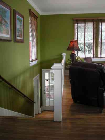 North-Hill:-123-West-Lloyd-Street_40.jpg:  french door, staircase, handrail, stairs, wooden blinds, ventian blinds, heartpine floors