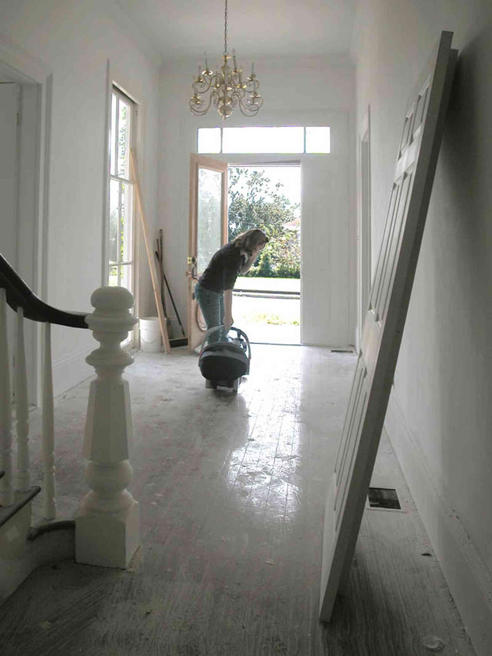 North-Hill:-200-West-Jackson-Street_21.jpg:  central hall, bannister, newel post, staircase, heartpine floor, chandelier, victorian house