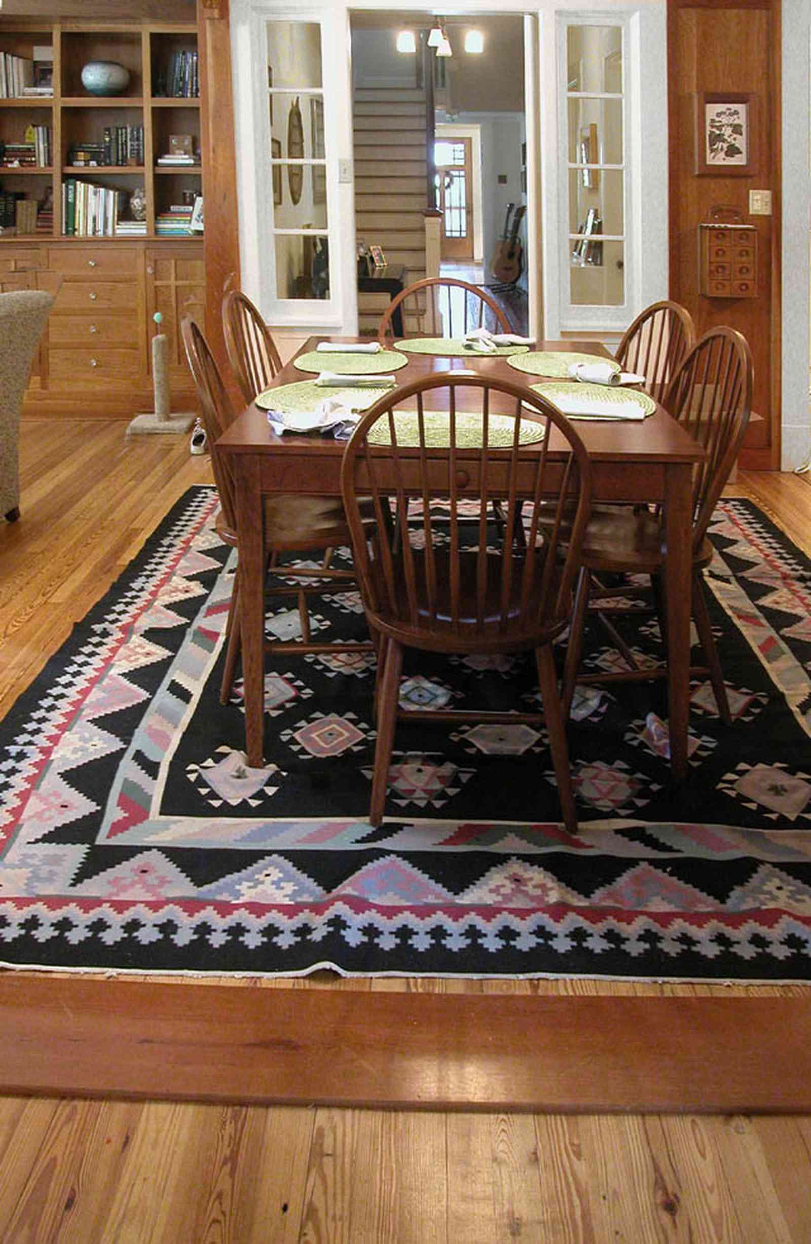 North-Hill:-284-West-Gonzales-Street_23.jpg:  dining room, staircase, library shelves, table, heartpine floors