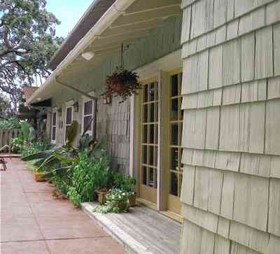 North-Hill:-284-West-Gonzales-Street_25.jpg:  shingle siding, hanging baskets, impatiens, pation door, craftsman cottage, oak tree