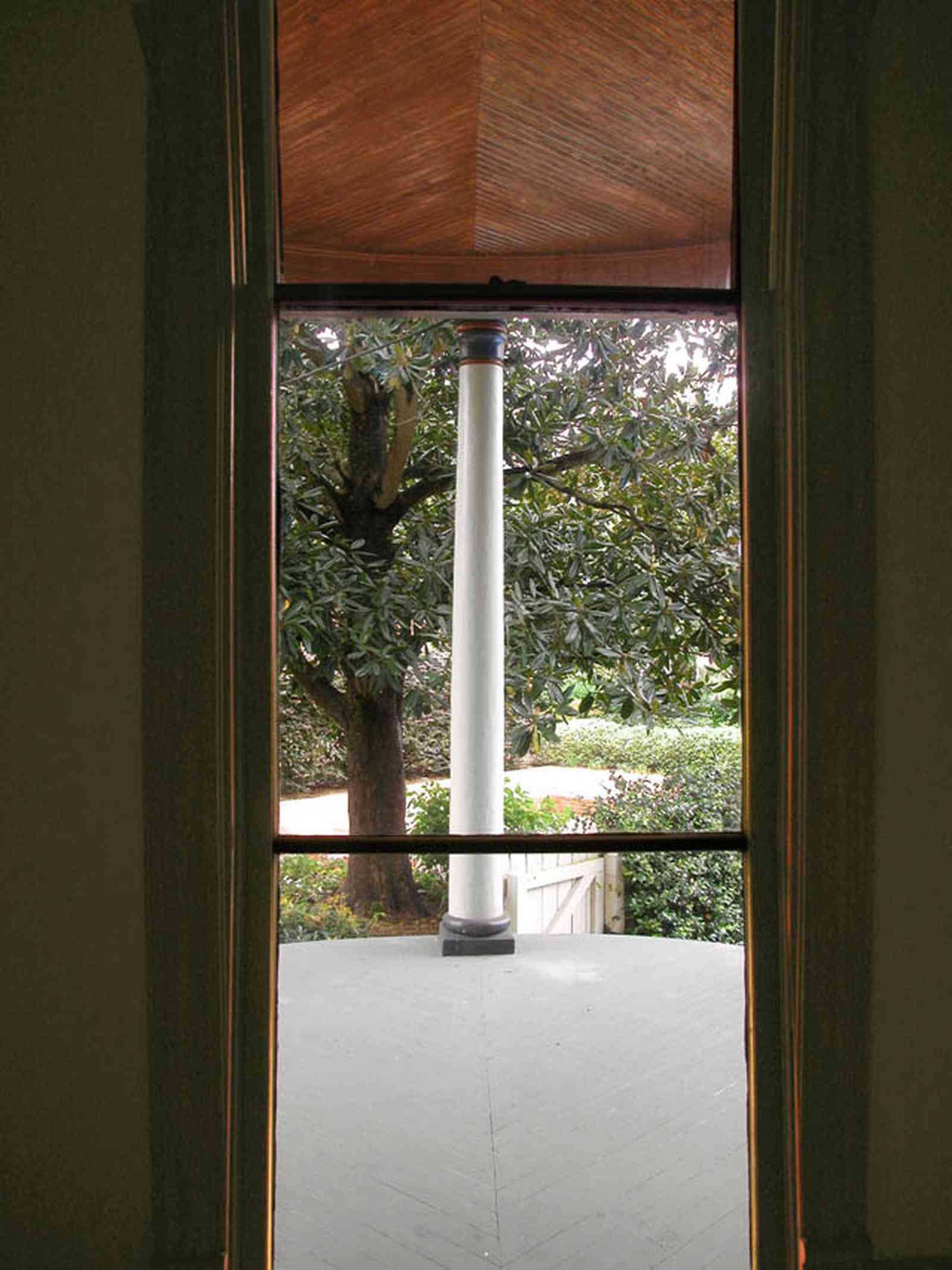 North-Hill:-304-West-Gadsden-Street_19.jpg:  heart pine lumber, beaded ceiling, magnolia tree, front porch, column, doric column, gate, picket fence