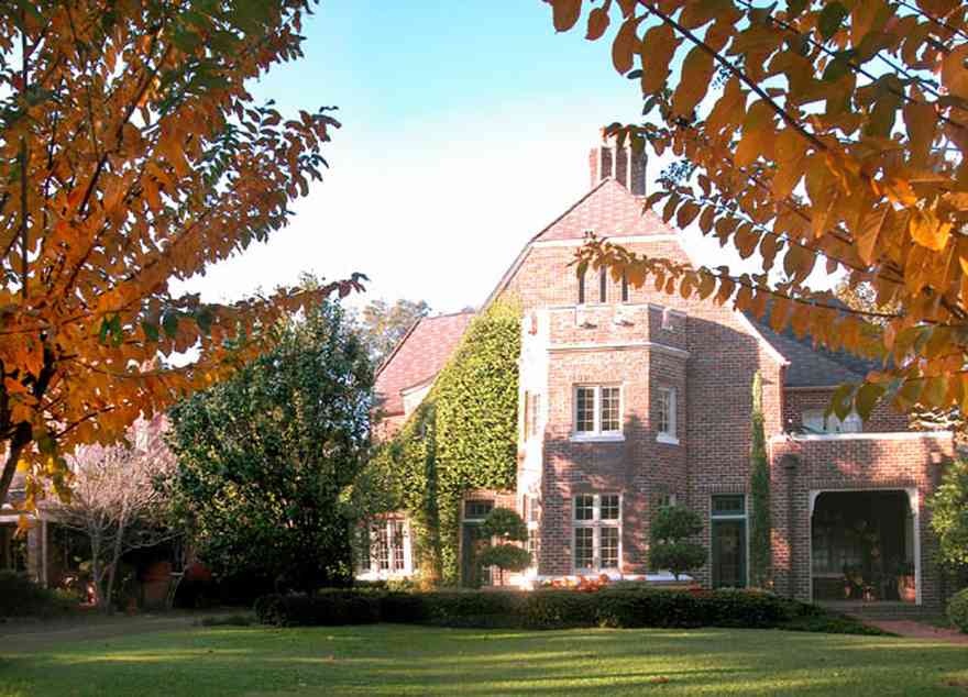 North-Hill:-406-Lloyd-Street_01.jpg:  fall colors, castle, medieval style, vine covered walls, casement windows, gothic revival architecture