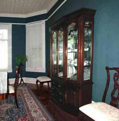 North-Hill:-52-West-Gonzalez-Street_10.jpg:  oriental rug, china cabinet, crown molding, dining room table, wooden floor