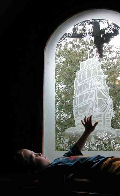 North-Hill:-52-West-Gonzalez-Street_30.jpg:  etched glass window, sailing ship, childrens room, attic, window seat