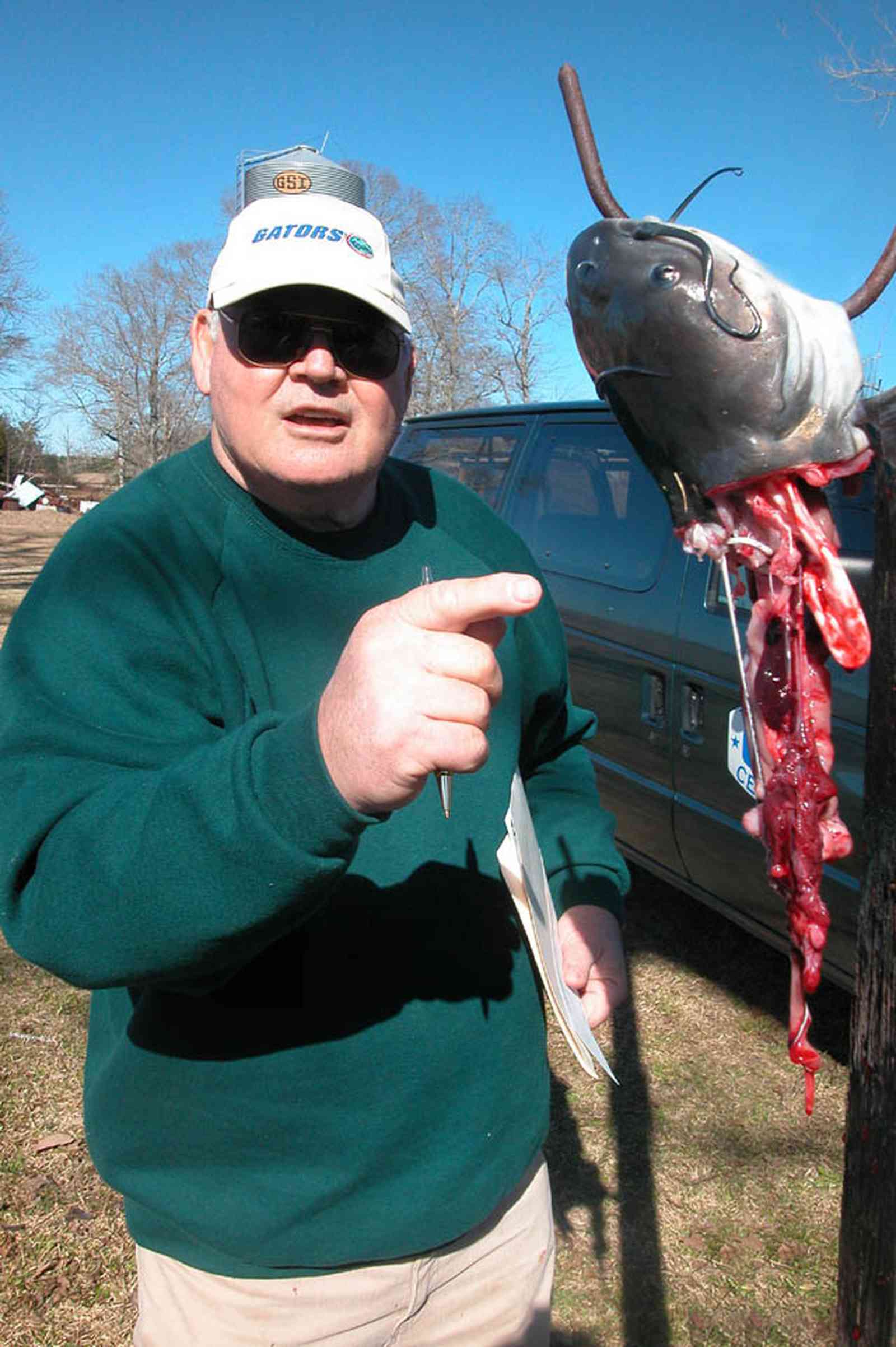 Oak-Grove:-Carpenters-Catfish-Farm_14.jpg:  entrails, catfish cleaning, gaffing hook
