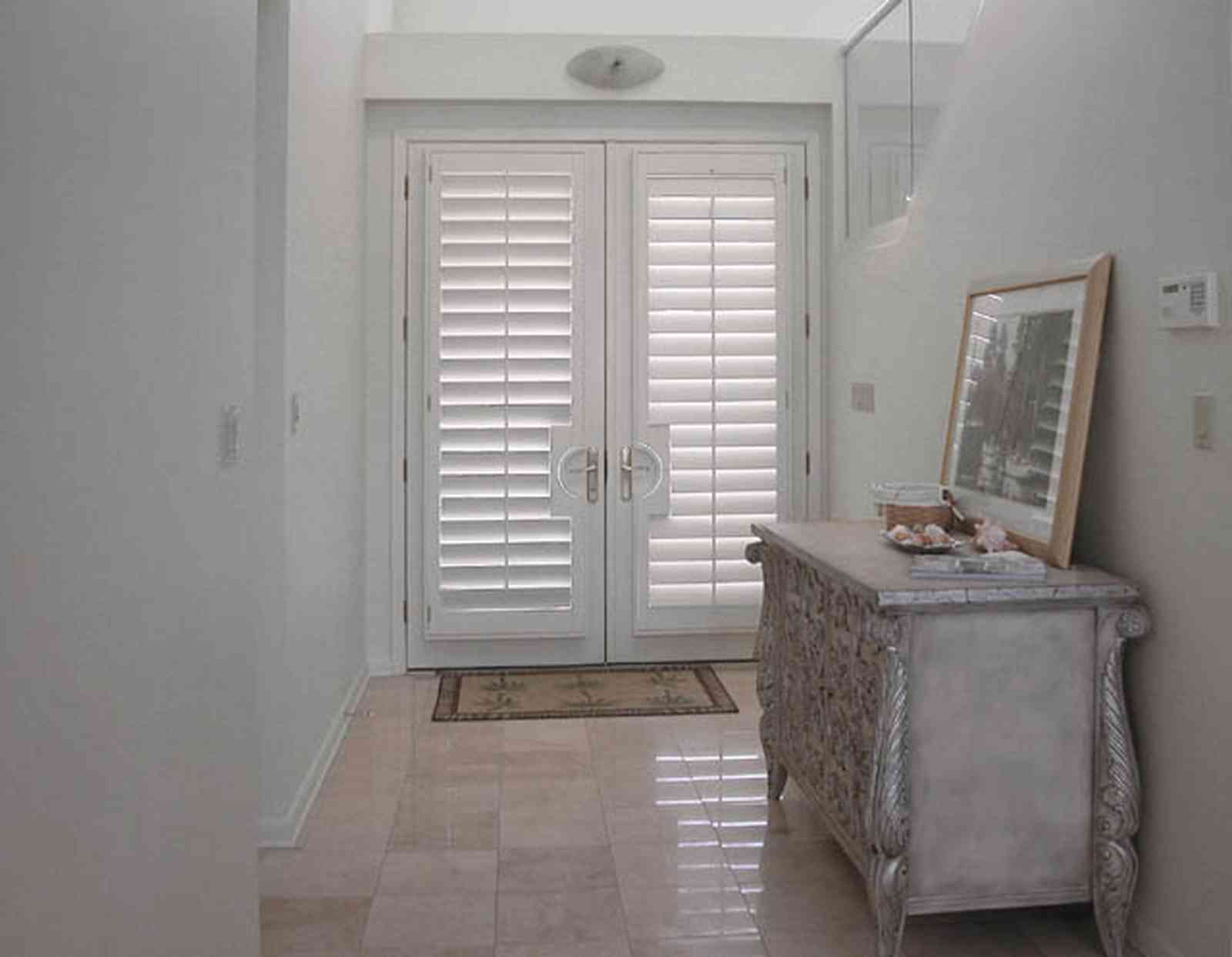 Pensacola-Beach:-1212-Ariola-Drive_02.jpg:  front door, travitine marble floor, foyer, hall, beach house, pensacola beach, gulf of mexico