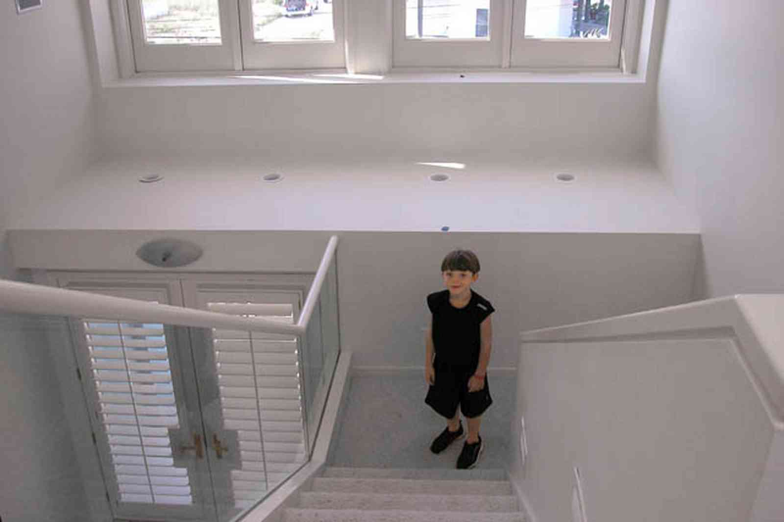 Pensacola-Beach:-1212-Ariola-Drive_03.jpg:  glass balcony, stairs, louvred door, modern architecture