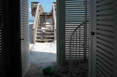 Pensacola-Beach:-1212-Ariola-Drive_28.jpg:  louvered door, steps, deck, quartz sand, emerald coast, pensacola beach, beach house