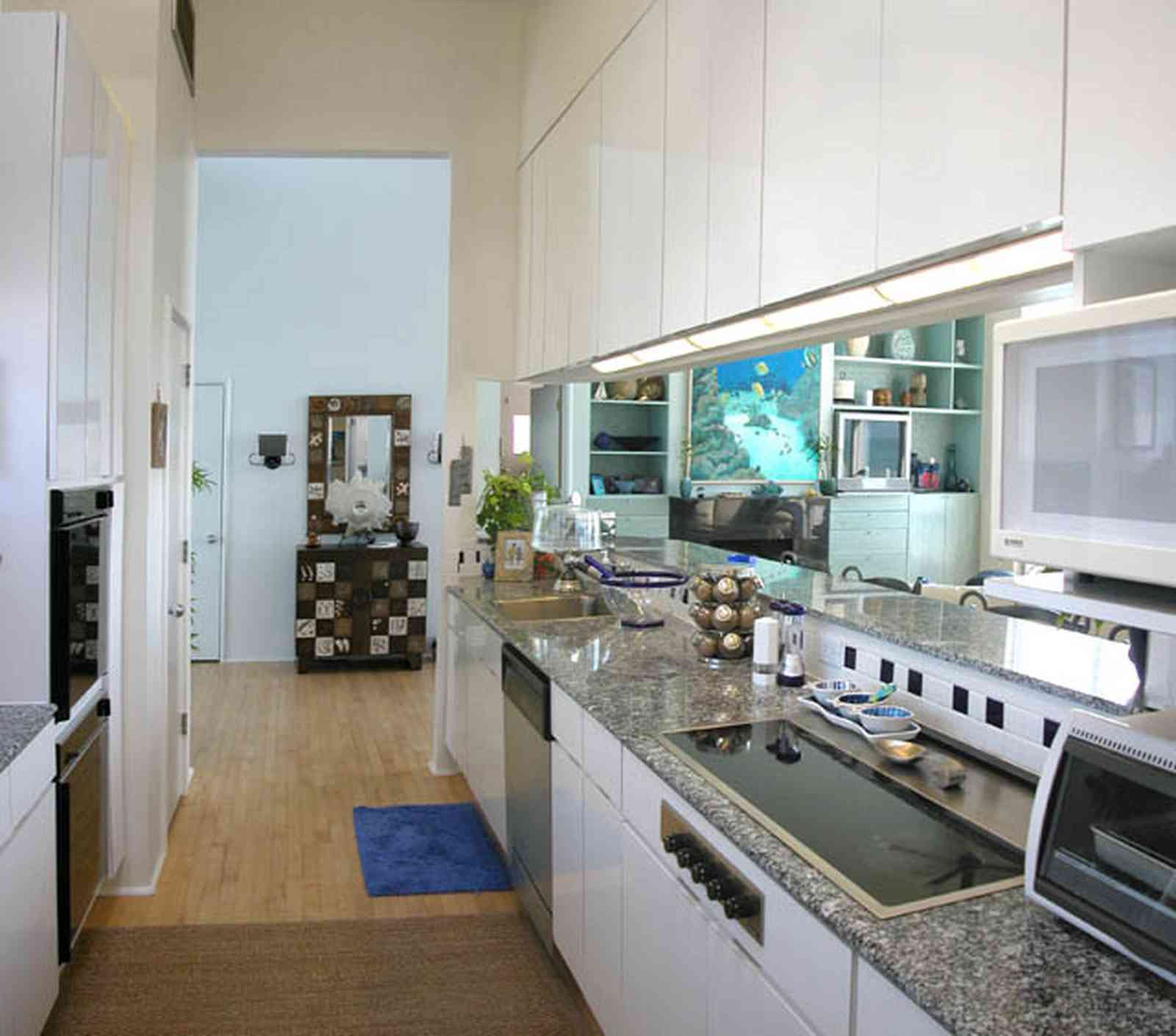 Pensacola-Beach:-Ariola-Drive-Art-Deco-House_25.jpg:  bauhaus architecture, wood floor, granite countertop, dishwasher, oven, kitchen cabinets, beachfront home, open floor plan, pensacola bay , 