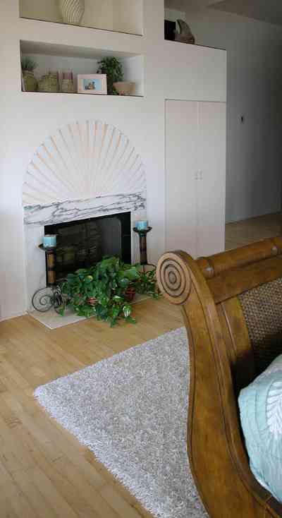 Pensacola-Beach:-Ariola-Drive-Art-Deco-House_40.jpg:  marble mantelpiece, sleigh bed, bedroom, wood floor, bedroom 