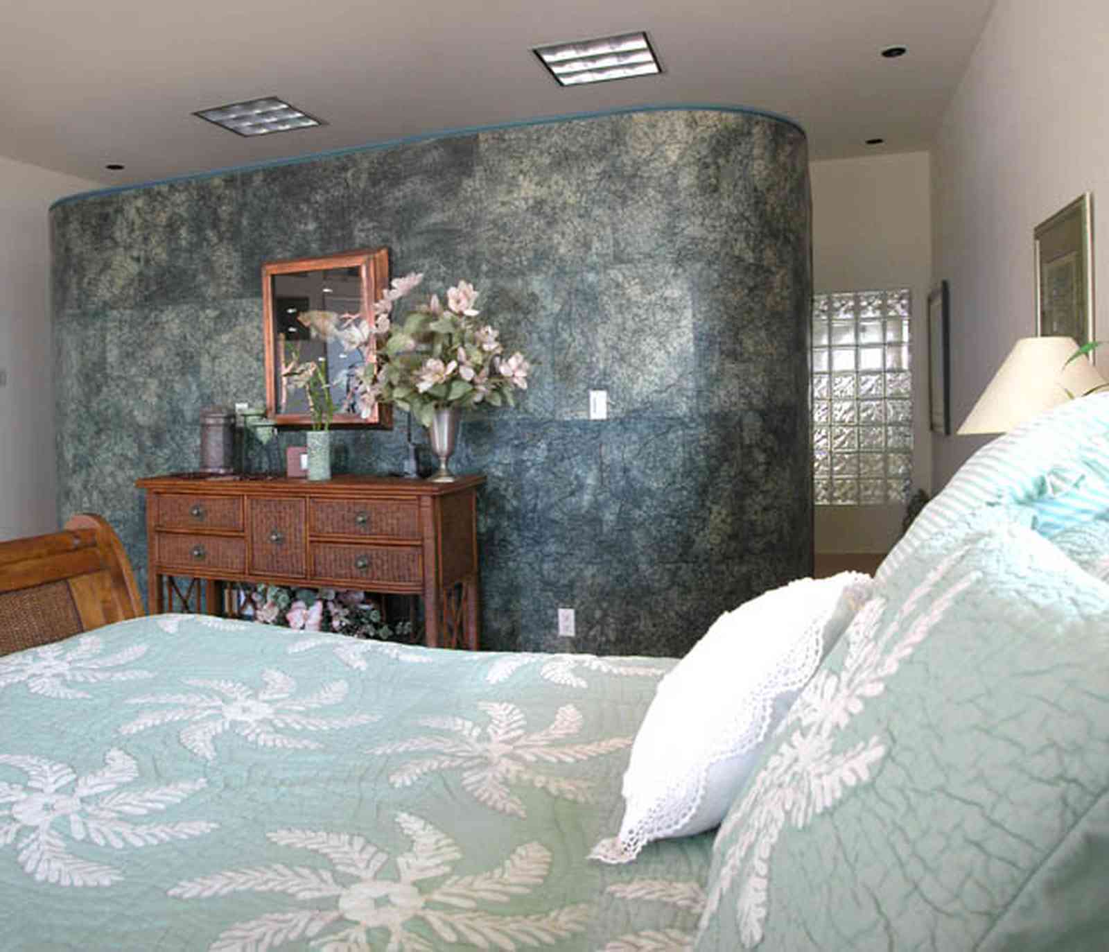 Pensacola-Beach:-Ariola-Drive-Art-Deco-House_41.jpg:  quilt, battenberg lace, dresser, flower arrangement, glass bricks, sleigh bed, gulf of mexico, 