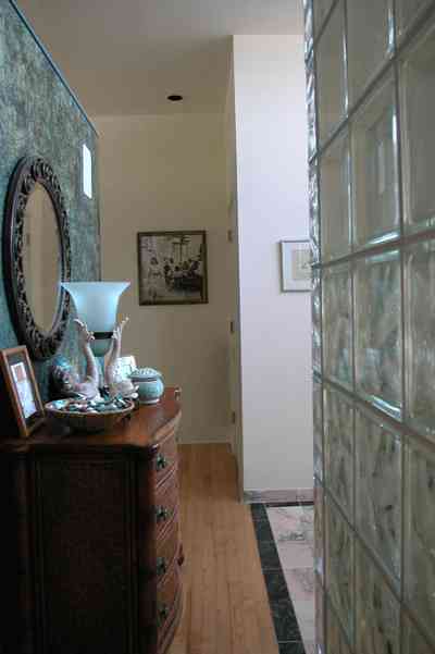 Pensacola-Beach:-Ariola-Drive-Art-Deco-House_42.jpg:  bathroom, dresser, seashell, marble floor, glass bricks, wood floor