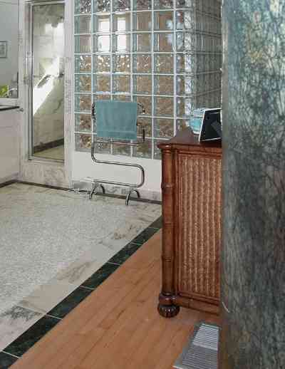 Pensacola-Beach:-Ariola-Drive-Art-Deco-House_43.jpg:  marble floor, dresser, glass bricks, shower