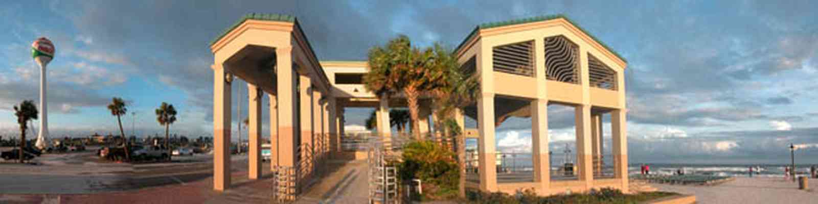 Pensacola-Beach:-Casino-Beach-Pavillion_02.jpg:  temple, beach ball, water tower, palm tree, amphitheater, beach front, surf, seating area, clearing skies, 
