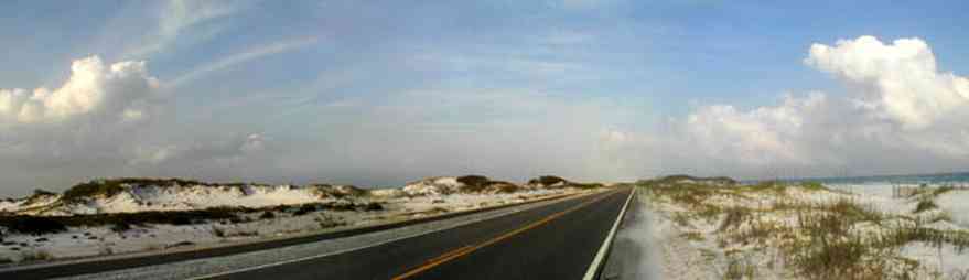 Pensacola-Beach:-Dunes-Road_01.jpg:  santa rosa island, gulf of mexico, gulf islands national seashore, escambia county, cumulus clouds, beach, sand dunes, emerald coast, two-lane road, curving road