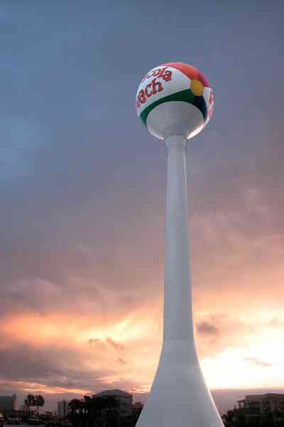 Pensacola-Beach:-Sunset_00.jpg:  water tower, sunset, palm tree, beach ball, mixed skies