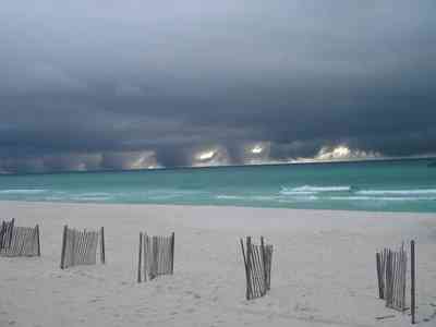 Pensacola-Beach:-Waterfront_13a.jpg:  weather front, storm, seashore,  beach, emerald water, dune fences, gulf of mexico, surf