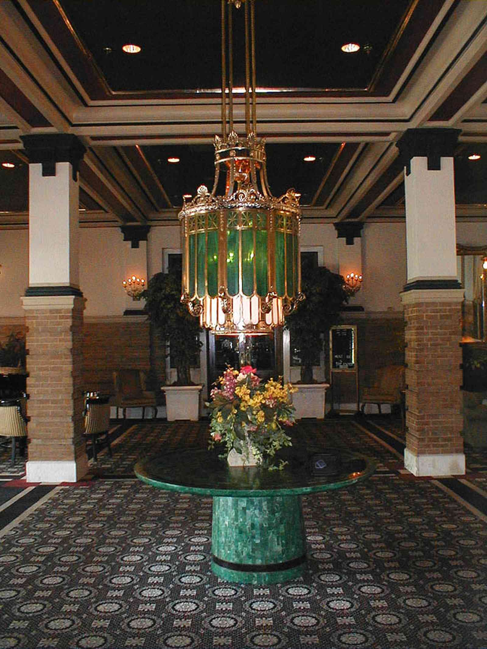 Pensacola:-Crowne-Plaza-Pensacola-Grand-Hotel_02.jpg:  hotel, railroad station, downtown, stained glass, marble table, tiffany lamp