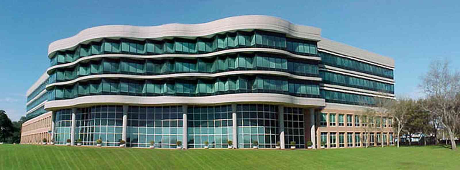 Pensacola:-Gateway-District:-Gulf-Power-Headquarters_01.jpg:  corporate headquarters, corporate building, bayfront parkway, green glass windows