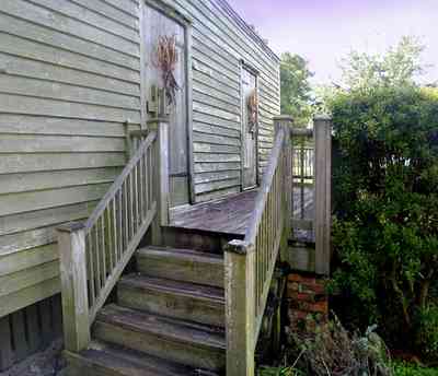 Pensacola:-Historic-Pensacola-Village:-Julee-Cottage_04.jpg:  porch, deck, pensacola historic village, slave quarters, victorian house, slave cottage, rough hewn wood