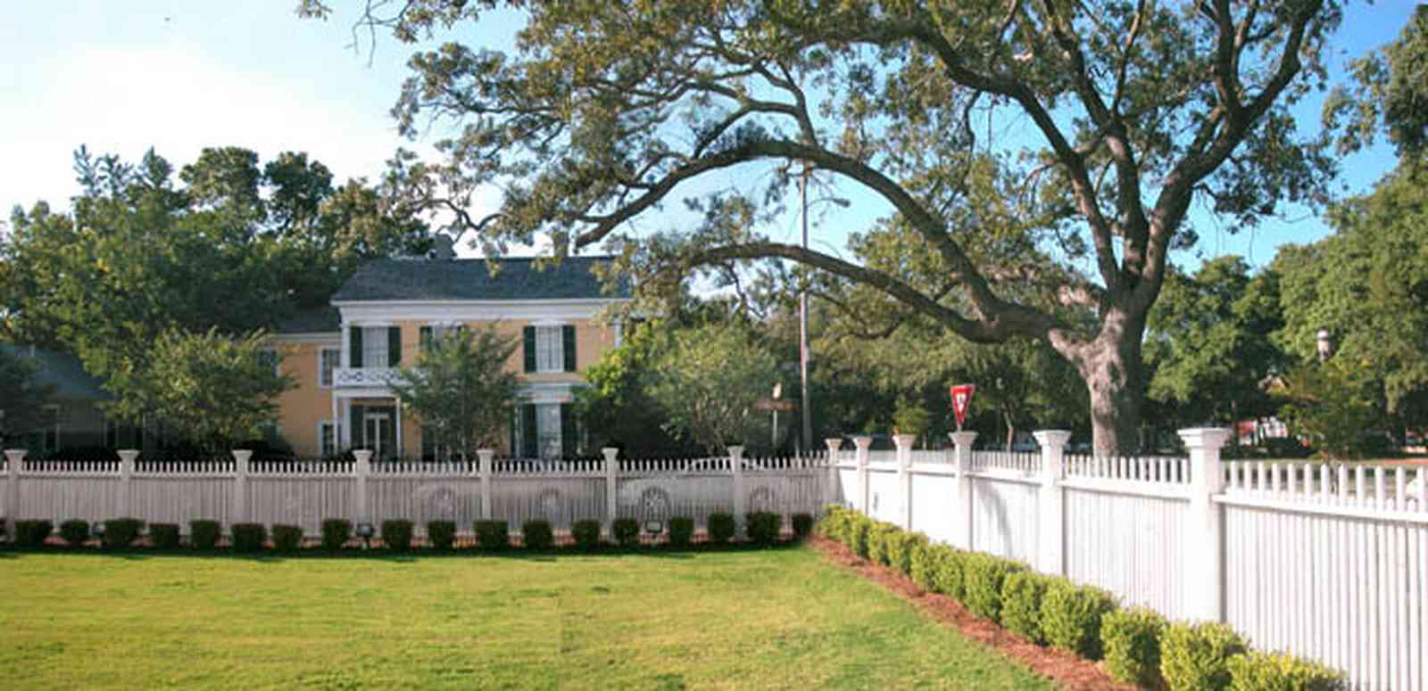 Pensacola:-Historic-Pensacola-Village:-Old-Christ-Church_08.jpg:  plaque, historic marker, brick structure, religious service, church house, dorr house, seville square, picket fence, victorian village