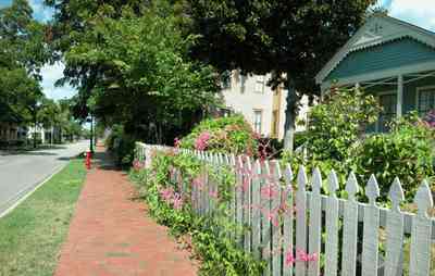 Pensacola:-Historic-Pensacola-Village:-Phieffer-House_01.jpg:  picket fence, brick sidewalk, shotgun cottage, dorr house, magnolia tree