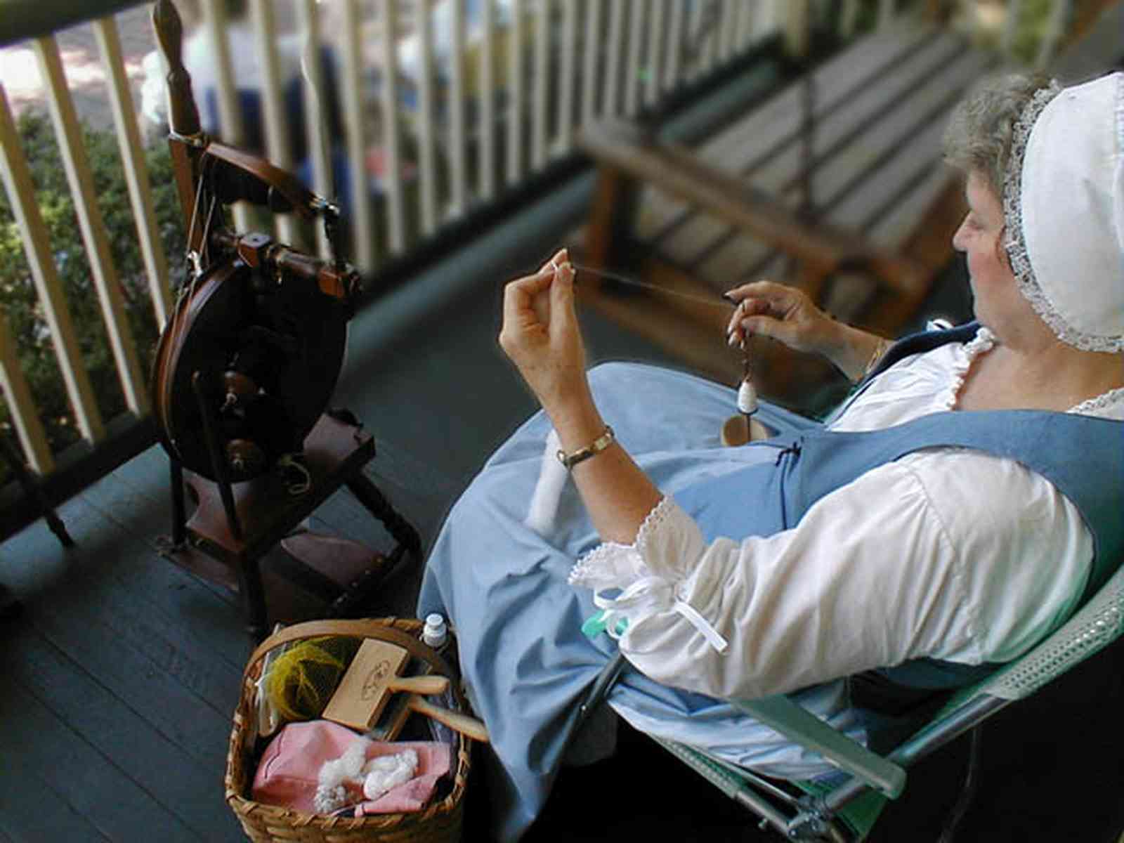 Pensacola:-Historic-Pensacola-Village:-The-Weavers-Cottage_05.jpg:  spinning, reenactors, historical reenactment, cotton thread, spinning wheel, historical reenactment, musuem