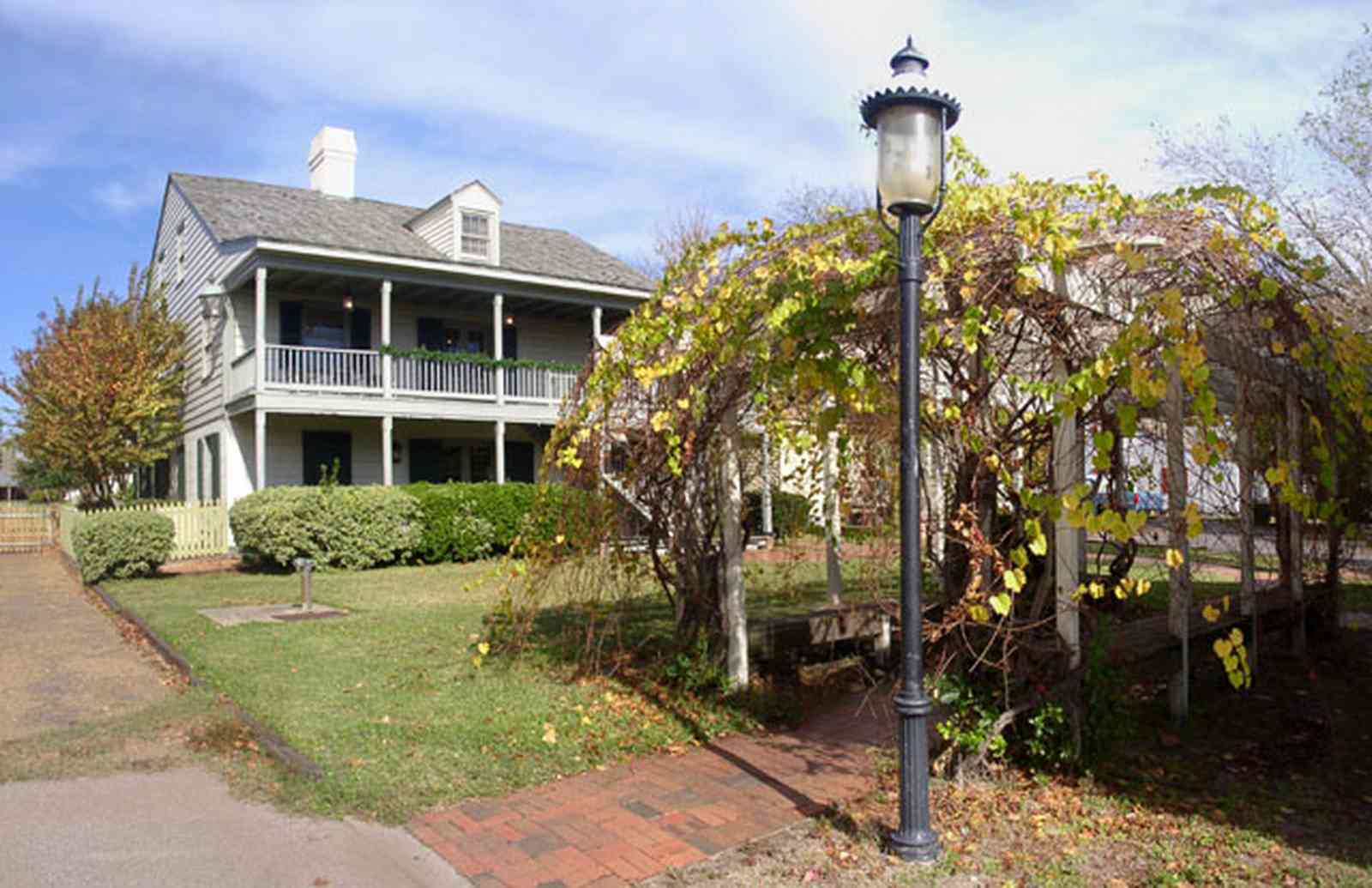 Pensacola:-Historic-Pensacola-Village:-Tivioli-House_01a.jpg:  arbor, lantern, victorian building, museum complex, pensacola historic village