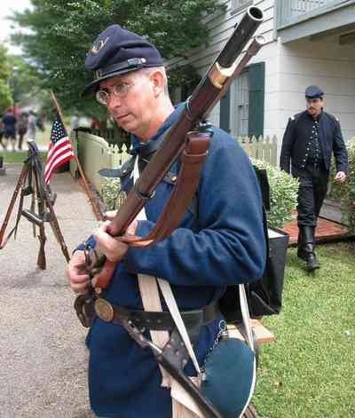 Pensacola:-Historic-Pensacola-Village:-Tivioli-House_01dd.jpg:  civil war soldier, encampment, battle, rifle, american flag, historic village, colonial village