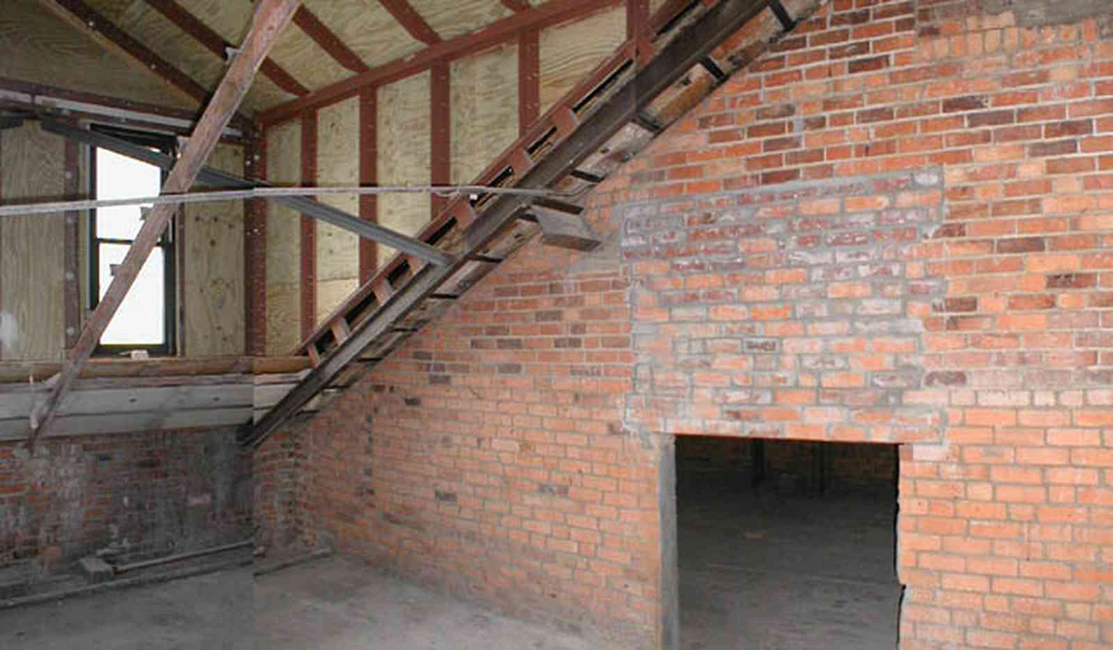 Pensacola:-Palafox-Historic-District:-Escambia-County-Courthouse_13.jpg:  attic, roof tiles, metal spring tension braces, brick walls