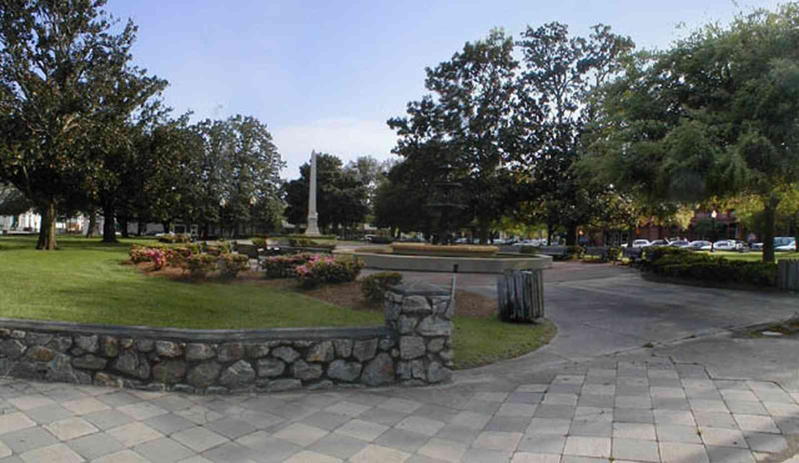 Pensacola:-Palafox-Historic-District:-Ferdinand-Plaza_00.jpg:  town square, plaza, obelisk, stone wall, oak trees, magnolia trees, historic district, courthouse, empire building