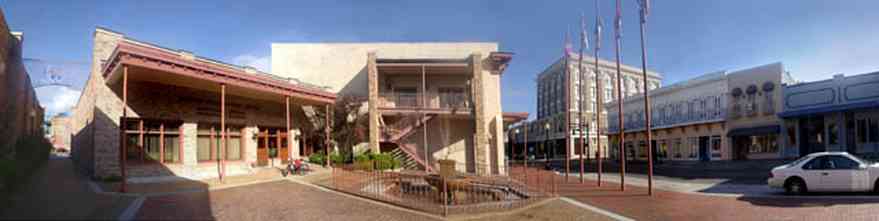 Pensacola:-Palafox-Historic-District:-Post-Office_01.jpg:  downtown streetscape, brick sidewalks, wrought-iron balcony