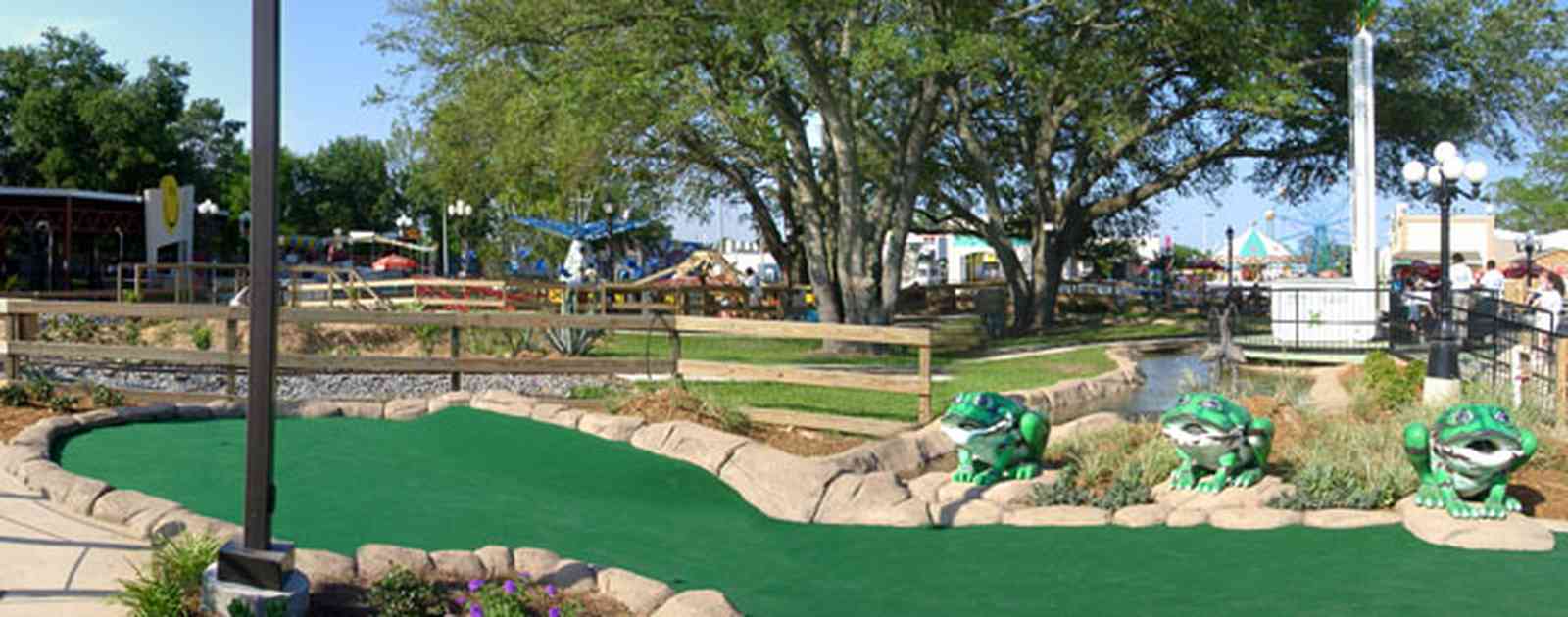 Pensacola:-Sams-Fun-City_10.jpg:  amusement park, rides, goofy golf, minature golf, frog sculptures, sam's fun city