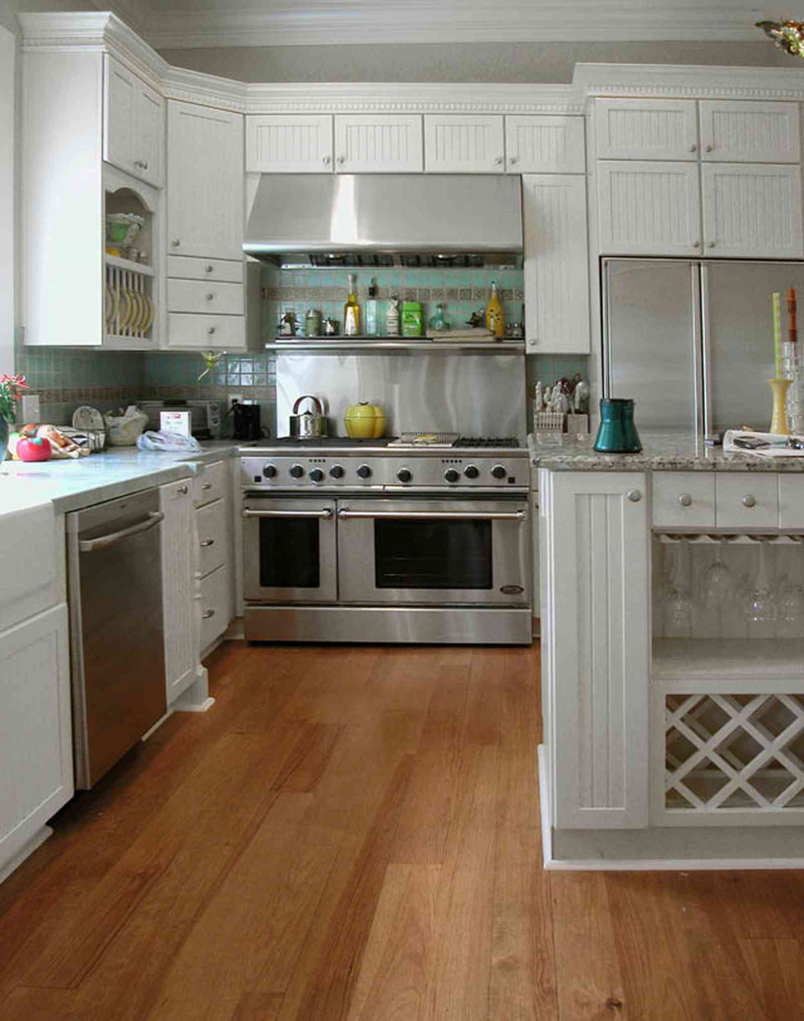 Pensacola:-Seville-Historic-District:-202-Cevallos-Street_17.jpg:  wine rack, heart pine floors, stainless steel stove, oven, range, kitchen cabines, green tile, victorian cottage