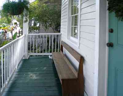 Pensacola:-Seville-Historic-District:-211-South-Florida-Blanca-Street_10.jpg:  deacons bench, porch, gulf coast cottage