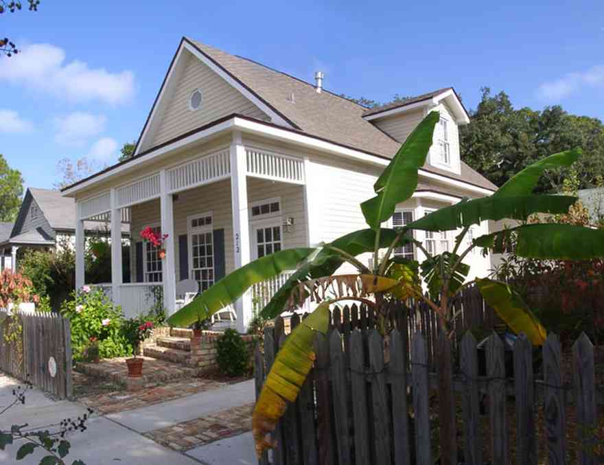 Pensacola:-Seville-Historic-District:-212-South-Florida-Blanca-Street_01.jpg:  victorian house, victorian front porch, historic district, banana tree, picket fence, gingerbread trim