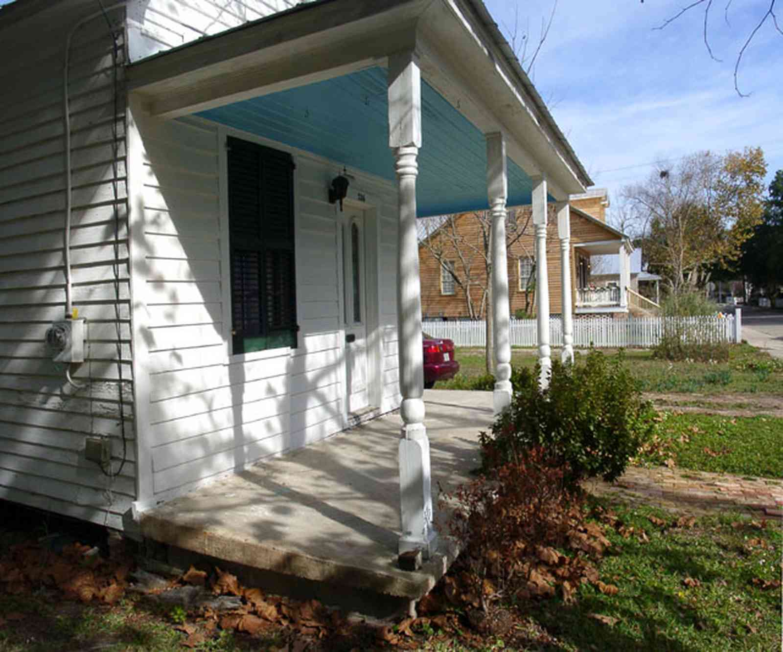 Pensacola:-Seville-Historic-District:-326-East-Intendencia-Street_05.jpg:  shotgun victorian house, porch, shutters