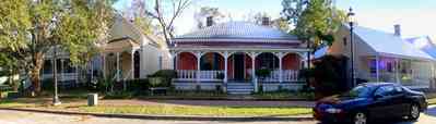 Pensacola:-Seville-Historic-District:-433-East-Zaragoza-Street_02.jpg:  pyramidal roof, four-square georgian architectural style, victorian house, victorian front porch, historic village